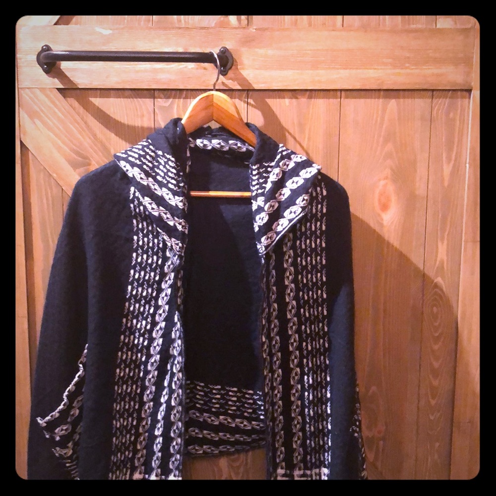Hooded shawl with pockets.